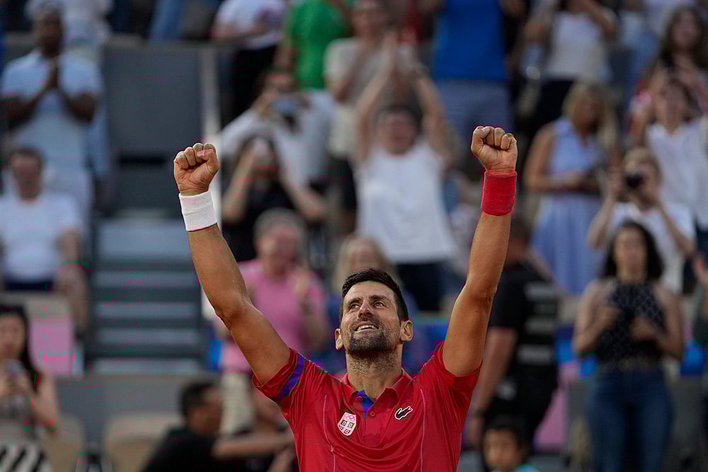 | Photo: AP/Andy Wong : Novak Djokovic celebrates after defeating Lorenzo Musetti 